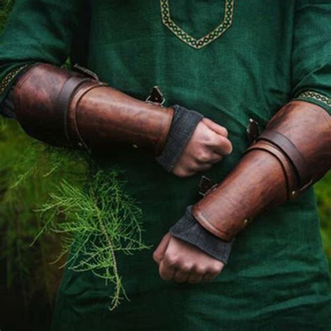 medieval bracers|tubular forearm guard.